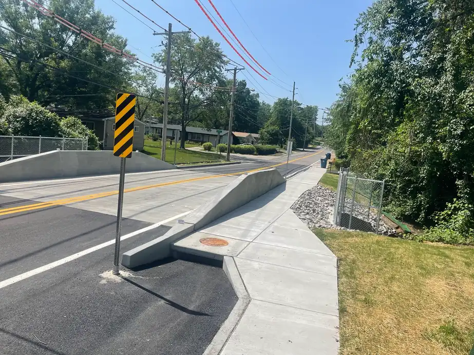The finished Buckley Road Bridge in St. Louis County: new concrete deck, curb and a separate pedestrian walkway