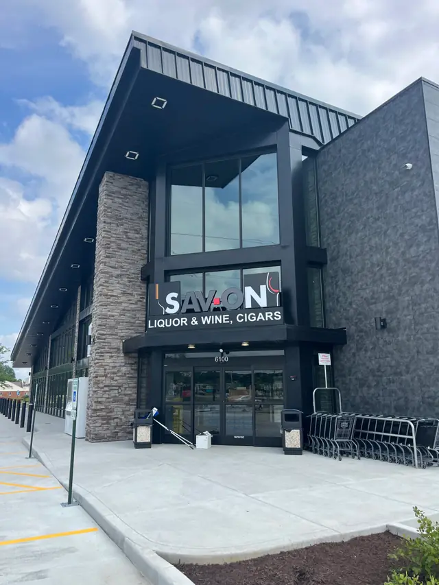Sav-On Liquor and Wine storefront in Edwardsville, Illinois with dark metal and stone facade